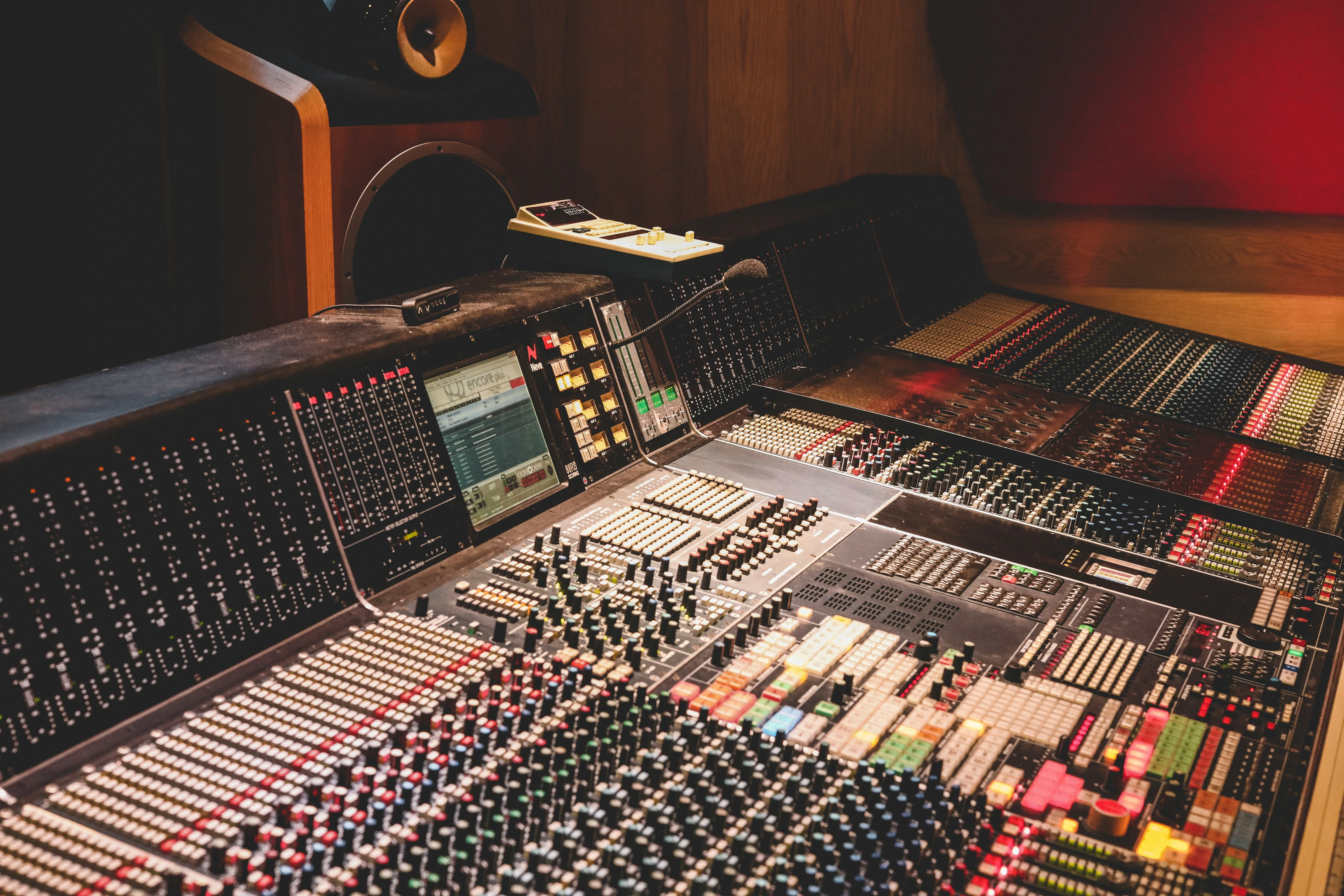 Broadcast microphone in front of a DAW screen